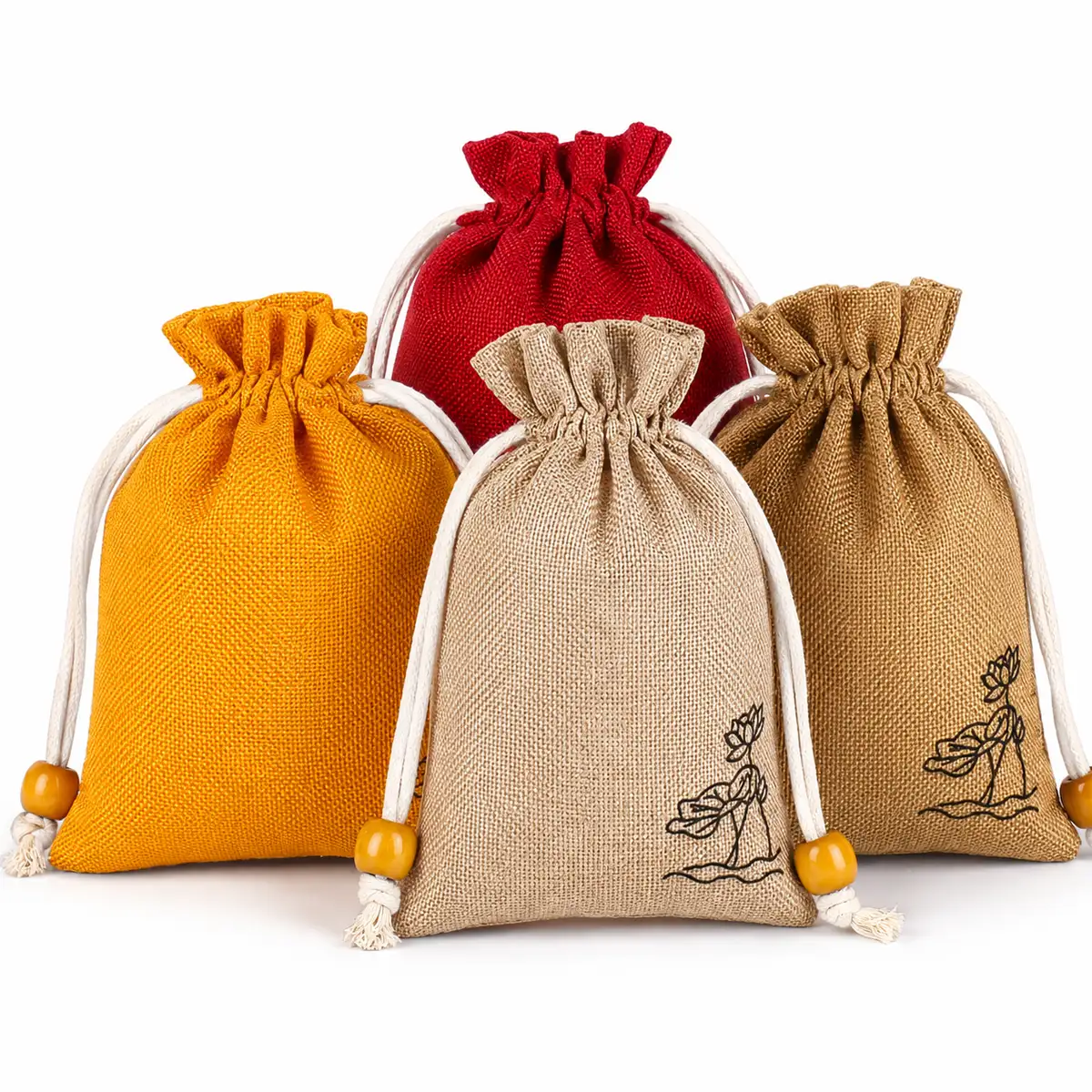 Linen fabric drawstring pouches in orange, red and natural tones with cord ties and small printed illustrations.