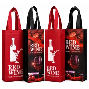 Four bulk non-woven single-bottle bags in red and black with loop handles and printed Red Wine bottle and glass artwork.