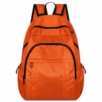 Bright orange travel backpack with black zips, multiple front pockets and padded shoulder straps.